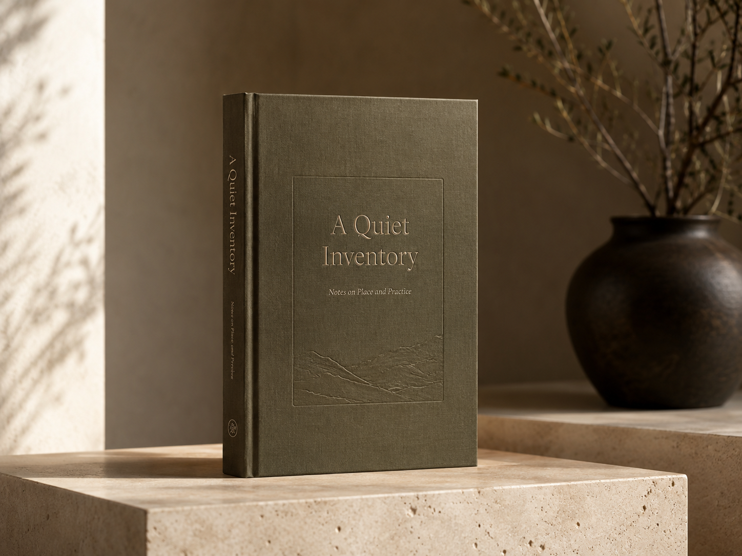 A cloth-bound book on a stone plinth in warm natural light